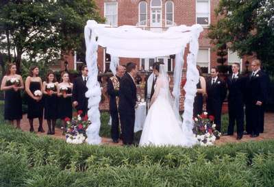 Under the chuppah in front of the Mansion