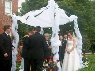 Aunt Pat doing a reading under the chuppah (photo courtesy of Uncle Greg)