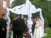 Aunt Pat doing a reading under the chuppah (photo courtesy of Uncle Greg)