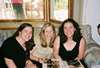 Miriam, Rachel, and Jess laughing over Miriam's Bat Mitzvah album