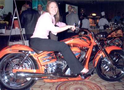 Posing on custom bike at magazine convention we worked at, DC