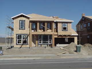 During the week of July 12th we finally got windows in the new house.  They have our front door in place and they are currently working on the ductwork.