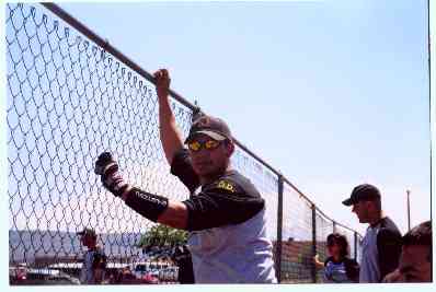 Paul, one of our groomsmen, cheers on his teammates at the softball tournament