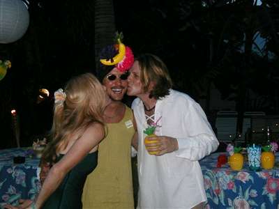 Kat and Brian kiss the ring bearer, Miss Carmen Miranda.