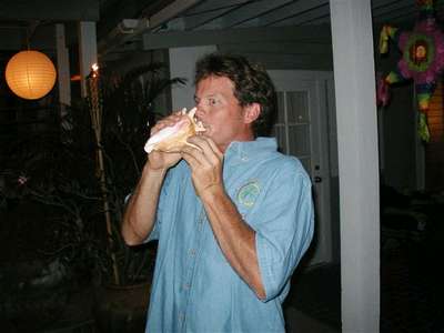 Ceremonial conch blowing calls the guests to gather for the wedding vows...