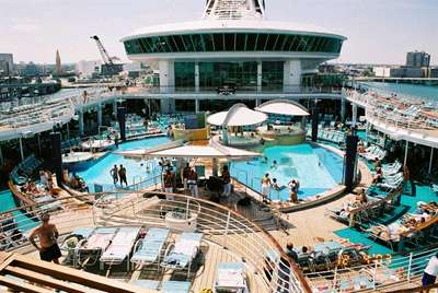 The main pool on deck 11 with seats on decks 12 and 13. The windows above is a bar called Dizzy's on deck 14